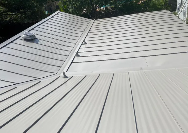 Solar attic fan installed on a metal roof for Roof Ventilation in Lower Nazareth